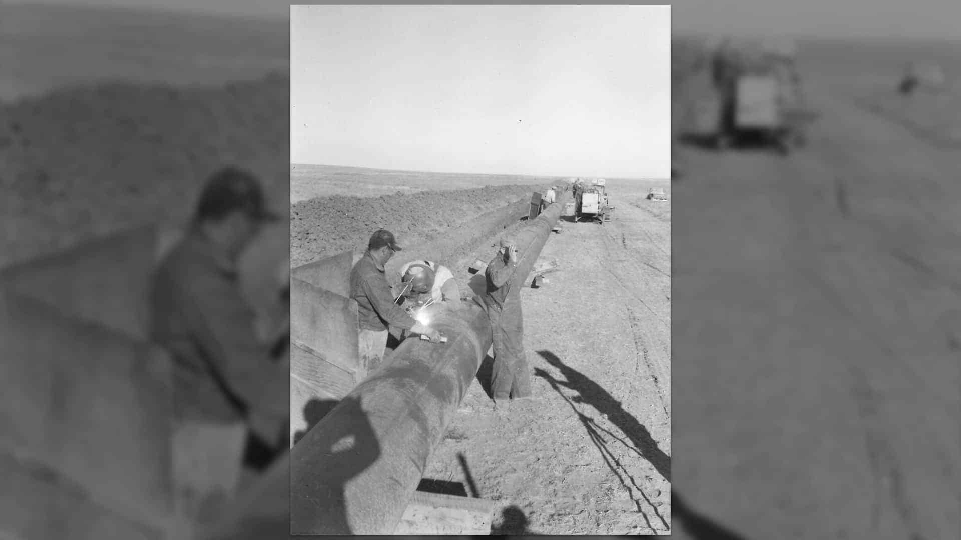 Team members work on the line for the Blackwell-Graham crossline construction (1955)